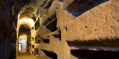 Underground tunnel with carved burial niches in the Roman catacombs