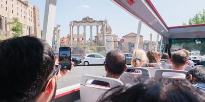 Touristation hop-on hop-off bus at the Temple of Saturn in the Roman Forum