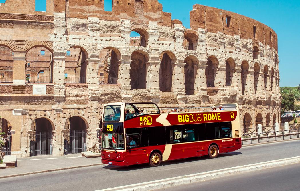 Hop-on-hop-off tourist bus in front of the Colosseum